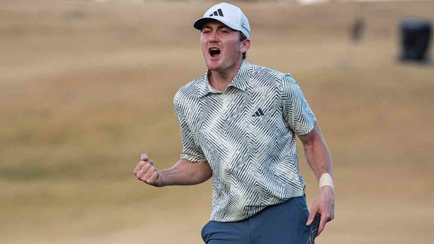 Nick Dunlap celebrates after sinking a putt on the 18th green to win the 2024 American Express at PGA West in La Quinta, Calif.